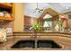 Close-up of a well-appointed kitchen sink and countertops at 390 Glengarry Chase, Covington, GA 30014
