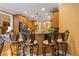 Eat-in kitchen boasts stainless steel appliances, granite countertops, and seating at the breakfast bar at 390 Glengarry Chase, Covington, GA 30014