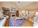 Elegant living room with fireplace, hardwood floors, and vaulted ceilings at 390 Glengarry Chase, Covington, GA 30014