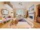 Bright and spacious living room with fireplace and large windows at 390 Glengarry Chase, Covington, GA 30014