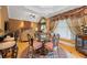 Formal living room featuring a soaring ceiling, large windows, and elegant, ornate decor and furniture at 390 Glengarry Chase, Covington, GA 30014