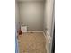 Empty room featuring tile floors and neutral colored walls with a partially-open door at 1931 Harvest Way, Loganville, GA 30052