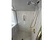 Shower stall with marbled walls, gold trim, adjustable shower head, and built-in soap dish at 1931 Harvest Way, Loganville, GA 30052