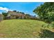 Spacious fenced backyard featuring lush green grass and a well-maintained lawn at 1553 Queen Elizabeth Dr, Locust Grove, GA 30248