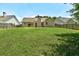 Large grassy backyard with a privacy fence, perfect for outdoor activities and relaxation at 1553 Queen Elizabeth Dr, Locust Grove, GA 30248