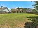 Lush backyard with expansive lawn and privacy fence, great for entertaining and play at 1553 Queen Elizabeth Dr, Locust Grove, GA 30248