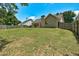 Expansive green backyard with surrounding fence providing a secure outdoor area at 1553 Queen Elizabeth Dr, Locust Grove, GA 30248