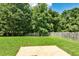 Spacious backyard with lush green grass and a patio area, perfect for outdoor entertaining at 1553 Queen Elizabeth Dr, Locust Grove, GA 30248