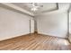 Bright bedroom with a ceiling fan, a large window, and wood flooring at 1553 Queen Elizabeth Dr, Locust Grove, GA 30248