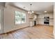 An eat-in kitchen area offers natural light, new light wood flooring, and transitions to the main kitchen at 1553 Queen Elizabeth Dr, Locust Grove, GA 30248