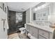 Elegant bathroom featuring a modern vanity, gray walls, and a glass-enclosed shower with dark tile at 3115 Seven Pines Ct # 308, Atlanta, GA 30339