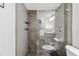 Modern bathroom highlighting a glass shower with stone tile and a contrasting dark mosaic floor at 3115 Seven Pines Ct # 308, Atlanta, GA 30339