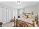 Inviting bedroom featuring natural light, closet space, and a gold-toned bed frame enhancing the room's charm at 3115 Seven Pines Ct # 308, Atlanta, GA 30339