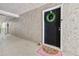 Unit entrance features a decorative wreath, welcome mat and fresh neutral paint at 3115 Seven Pines Ct # 308, Atlanta, GA 30339