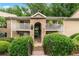 Condo building with multiple units, patios, mature trees, and easy access via exterior stairs at 3115 Seven Pines Ct # 308, Atlanta, GA 30339