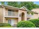 Charming condo building with inviting patios and manicured landscaping at 3115 Seven Pines Ct # 308, Atlanta, GA 30339