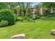 Lush green lawn with landscaped areas and a view of the apartment building in a tranquil setting at 3115 Seven Pines Ct # 308, Atlanta, GA 30339