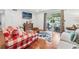 Bright living room featuring hardwood floors, comfortable seating, and sliding glass doors to the balcony at 3115 Seven Pines Ct # 308, Atlanta, GA 30339