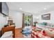 Hardwood floors flow throughout the open living room with sliding doors to the outdoor patio at 3115 Seven Pines Ct # 308, Atlanta, GA 30339