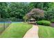 Community tennis courts with a gazebo and walking path nearby at 3115 Seven Pines Ct # 308, Atlanta, GA 30339