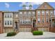 Charming townhomes with brick and stone facades, manicured landscaping, and individual garages at 346 Ardmore Ct, Atlanta, GA 30309