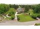 Aerial view of a landscaped yard and home on a lake at 794 Rutland Ct, Lithonia, GA 30058