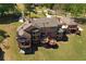 A view of the rear of the property, which features a large deck and manicured lawn at 794 Rutland Ct, Lithonia, GA 30058