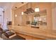 Granite bar featuring pendant lighting, wine racks, and glassware storage at 794 Rutland Ct, Lithonia, GA 30058
