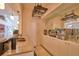 Open bar area with countertop, modern lighting, and lots of storage adding functional elegance to the space at 794 Rutland Ct, Lithonia, GA 30058