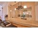 Stylish home bar with granite countertop, modern lighting, and bar stools offers a place to entertain at 794 Rutland Ct, Lithonia, GA 30058