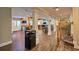 Finished basement with a bar, staircase, columns, and warm wood flooring offers a versatile living space at 794 Rutland Ct, Lithonia, GA 30058