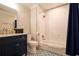 Stylish bathroom featuring subway tiles, modern fixtures, and a blue vanity, offering a blend of comfort and elegance at 794 Rutland Ct, Lithonia, GA 30058