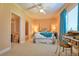 Spacious bedroom with neutral carpet, soft lighting, a walk-in closet, and adjacent bathroom at 794 Rutland Ct, Lithonia, GA 30058