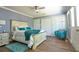 Bedroom with hardwood floors and a comfortable bed, chair, and large closets at 794 Rutland Ct, Lithonia, GA 30058