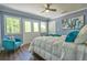 Bright bedroom features natural light, chair, modern windows, and hardwood floors at 794 Rutland Ct, Lithonia, GA 30058