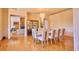 Formal dining room with wood floors, large chandelier, and ample seating for entertaining at 794 Rutland Ct, Lithonia, GA 30058