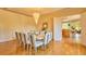 Bright dining room features hardwood floors, chandelier and seating for ten at 794 Rutland Ct, Lithonia, GA 30058
