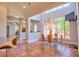 Bright and airy dining area with tile floors, ample windows, and a view of the backyard and deck at 794 Rutland Ct, Lithonia, GA 30058