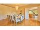 Traditional dining room features a grand chandelier and an open pass through to the eat-in kitchen at 794 Rutland Ct, Lithonia, GA 30058