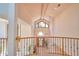 Grand foyer with high ceilings and large windows overlooking the front door and landscaping at 794 Rutland Ct, Lithonia, GA 30058