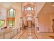 Grand foyer featuring soaring ceilings, a large window and an elegant staircase at 794 Rutland Ct, Lithonia, GA 30058