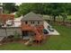 View of the detached garage with a deck overlooking the lawn and driveway at 794 Rutland Ct, Lithonia, GA 30058