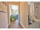 Hallway view to bathroom featuring decorative tile flooring and bathtub and shower at 794 Rutland Ct, Lithonia, GA 30058