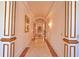 Elegant hallway featuring decorative moldings, recessed lighting, and marble floors at 794 Rutland Ct, Lithonia, GA 30058