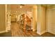 Long hallway with staircase to the left, interior doors and wood flooring at 794 Rutland Ct, Lithonia, GA 30058