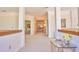 Upstairs hallway featuring neutral carpet, white trim, and views into other rooms at 794 Rutland Ct, Lithonia, GA 30058