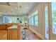 Open concept kitchen with bar seating, granite countertops, and a seamless connection to the outdoors at 794 Rutland Ct, Lithonia, GA 30058