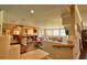Inviting living area with comfortable seating, a bar, and large windows offering plenty of natural light at 794 Rutland Ct, Lithonia, GA 30058