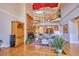Bright and open living room boasts floor to ceiling windows, a fireplace, and a view of the beautiful surrounding landscape at 794 Rutland Ct, Lithonia, GA 30058