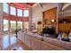 Large living room with hardwood floors, a fireplace, natural light, and lake views at 794 Rutland Ct, Lithonia, GA 30058